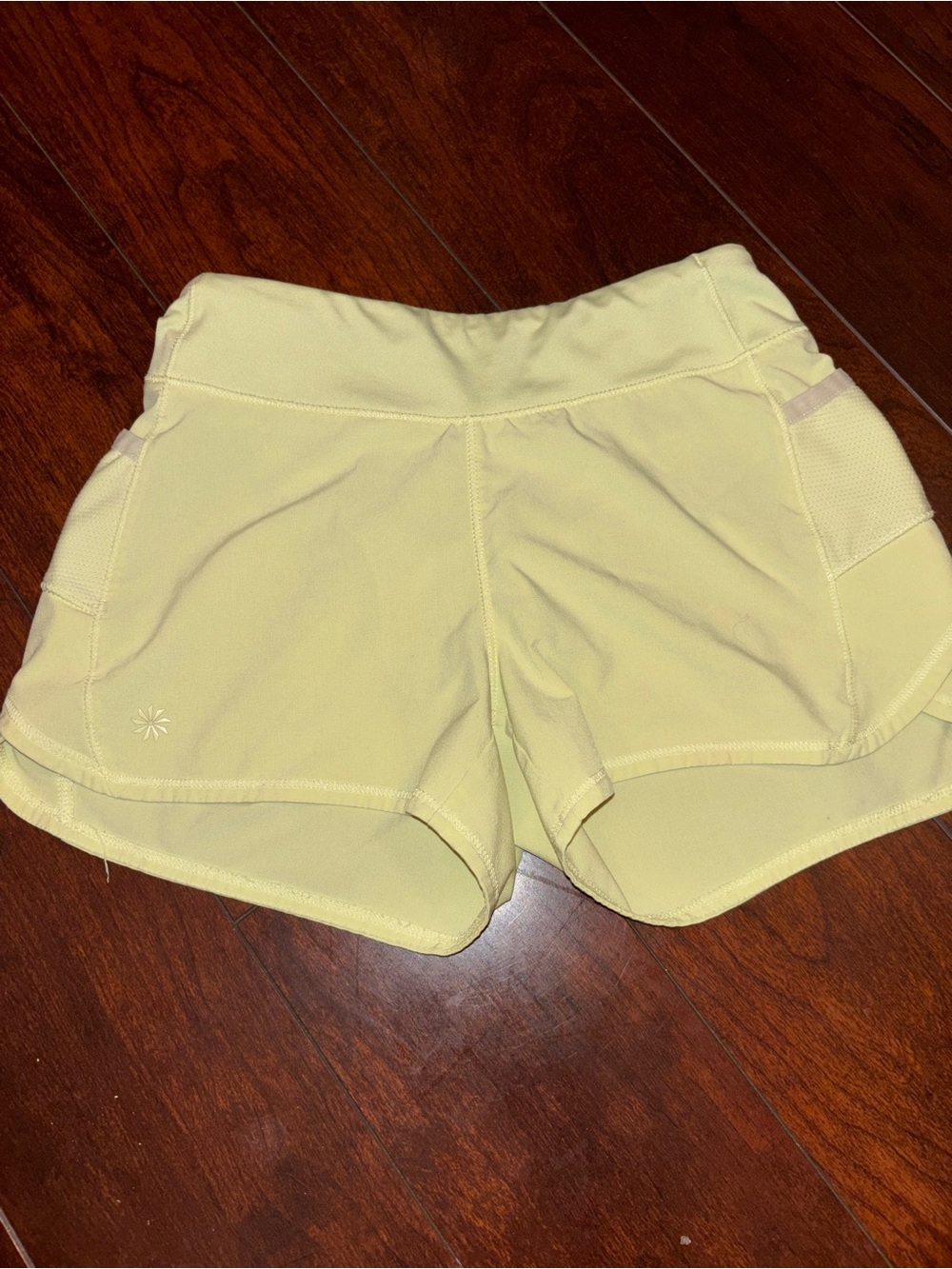 Athleta Pale Yellow Athletic Shorts with Side Pockets